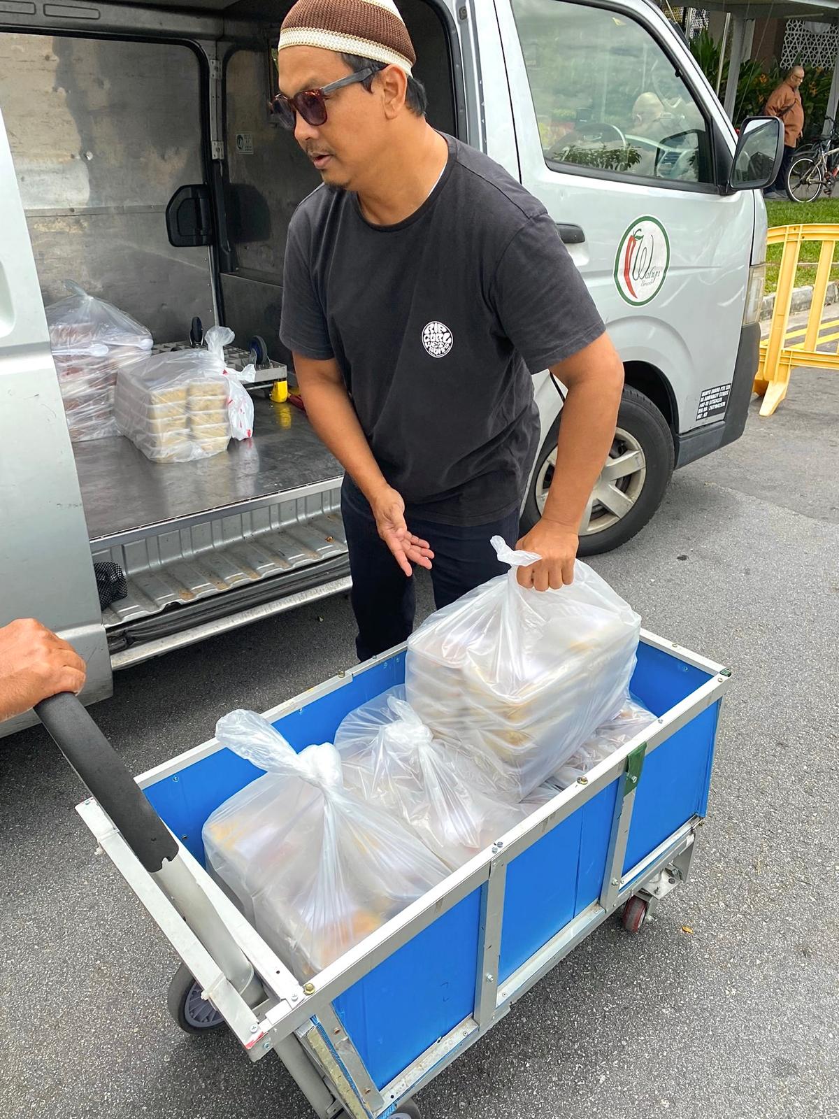 Unloading of Food Bento Donation to local mosque